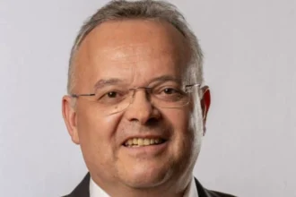 Gerald Hauser Urged to Intervene in Belgiangate